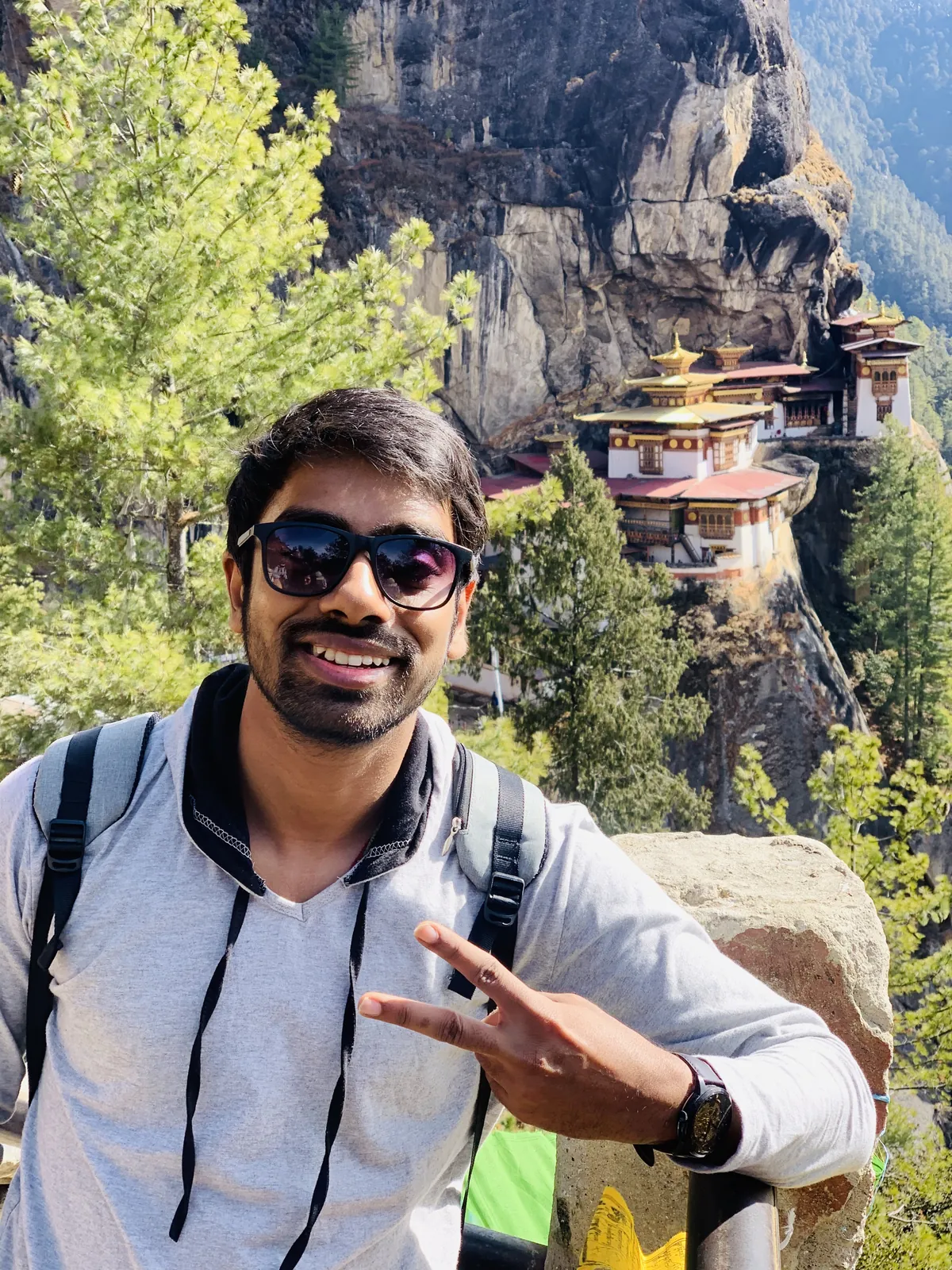 Man posing famous on the Bhutan group trip with One in the Orange Jacket.