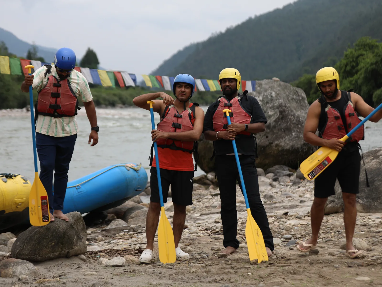 Friends ready rafting adventure on the Bhutan group trip with One in the Orange Jacket.