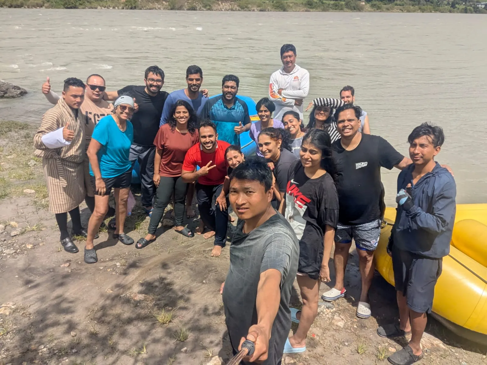 Water smiles on the Bhutan group trip with One in the Orange Jacket.