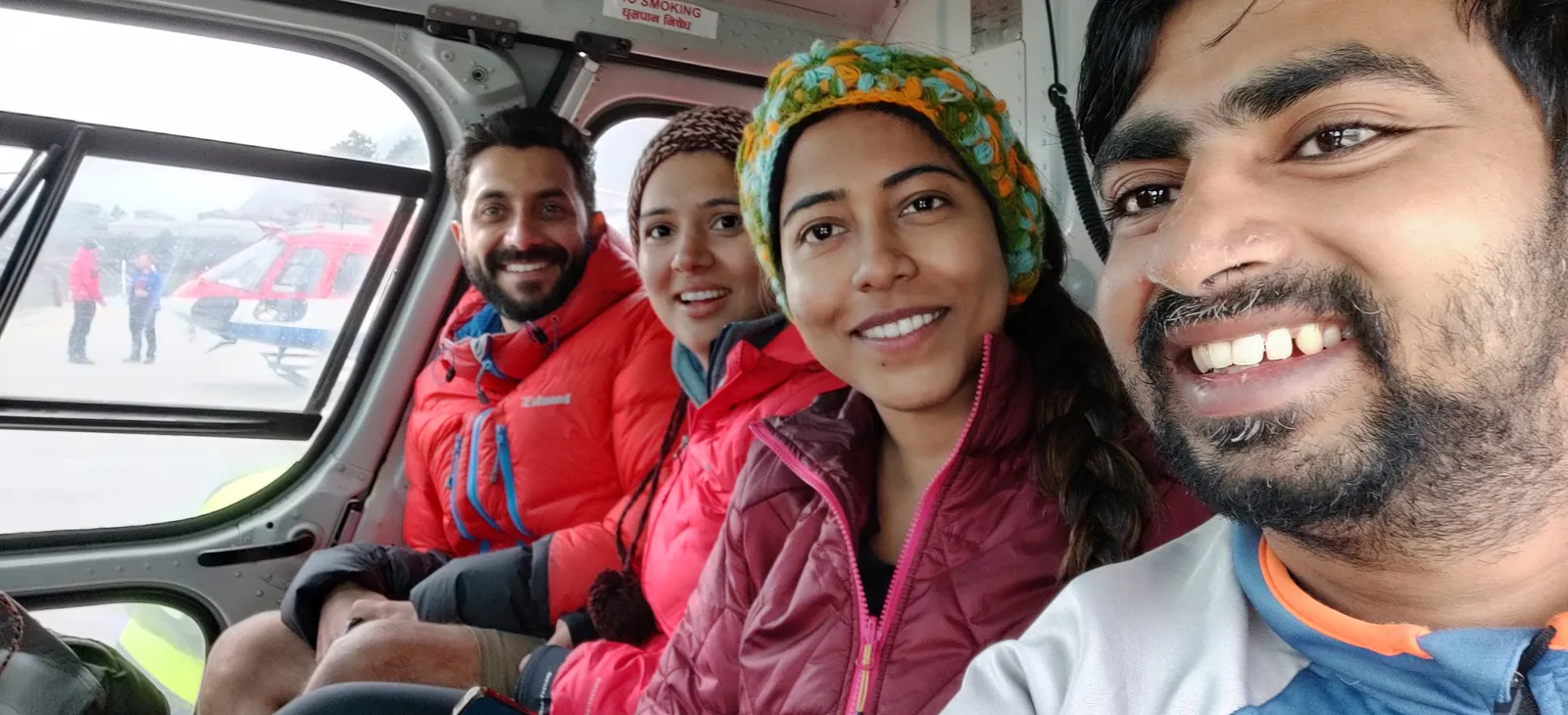 Selfie inside helicopter on the Everest Base Camp group trip with One in the Orange Jacket.