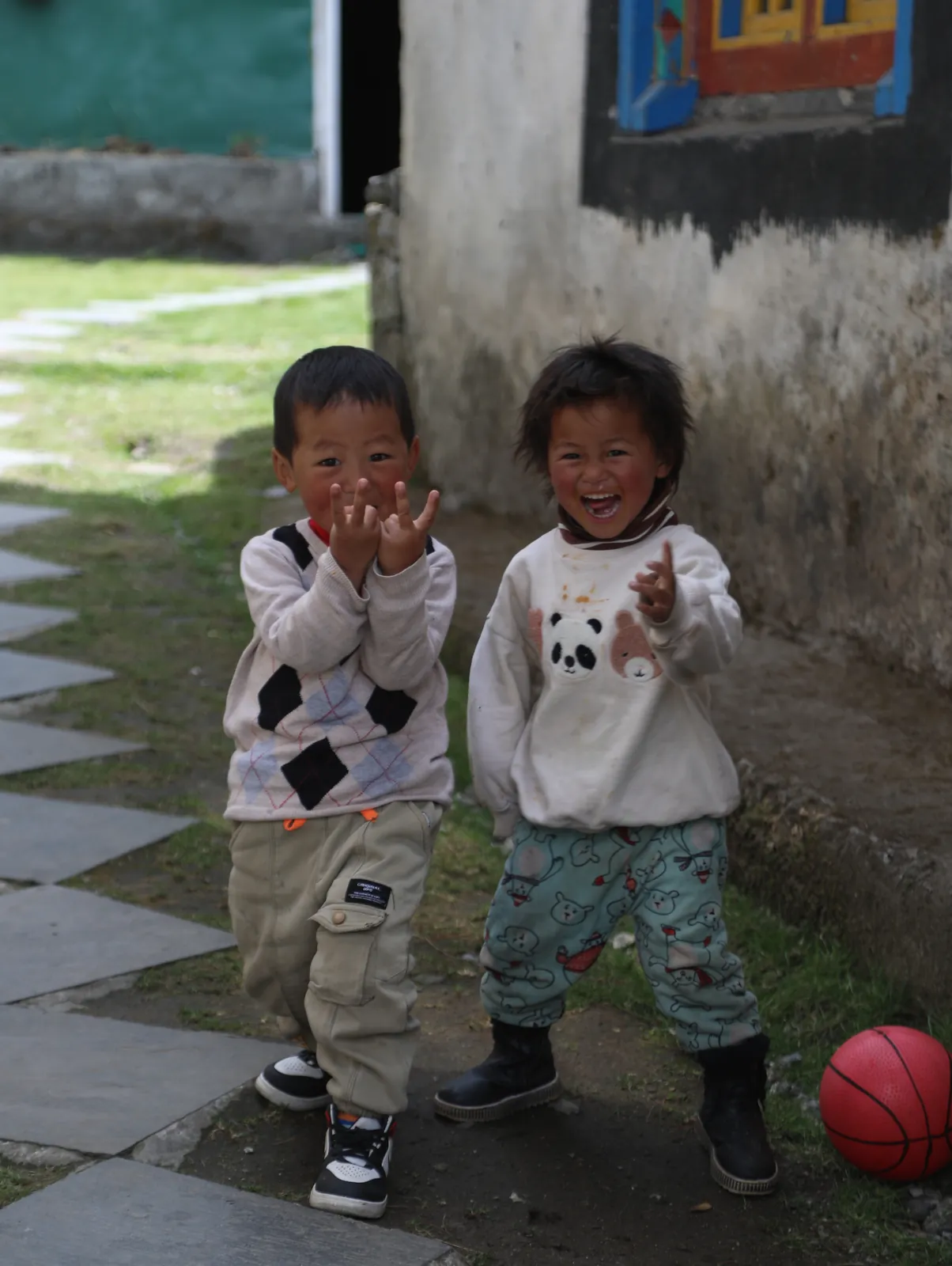 Children smiling posing emotion on the Everest Base Camp group trip with One in the Orange Jacket.