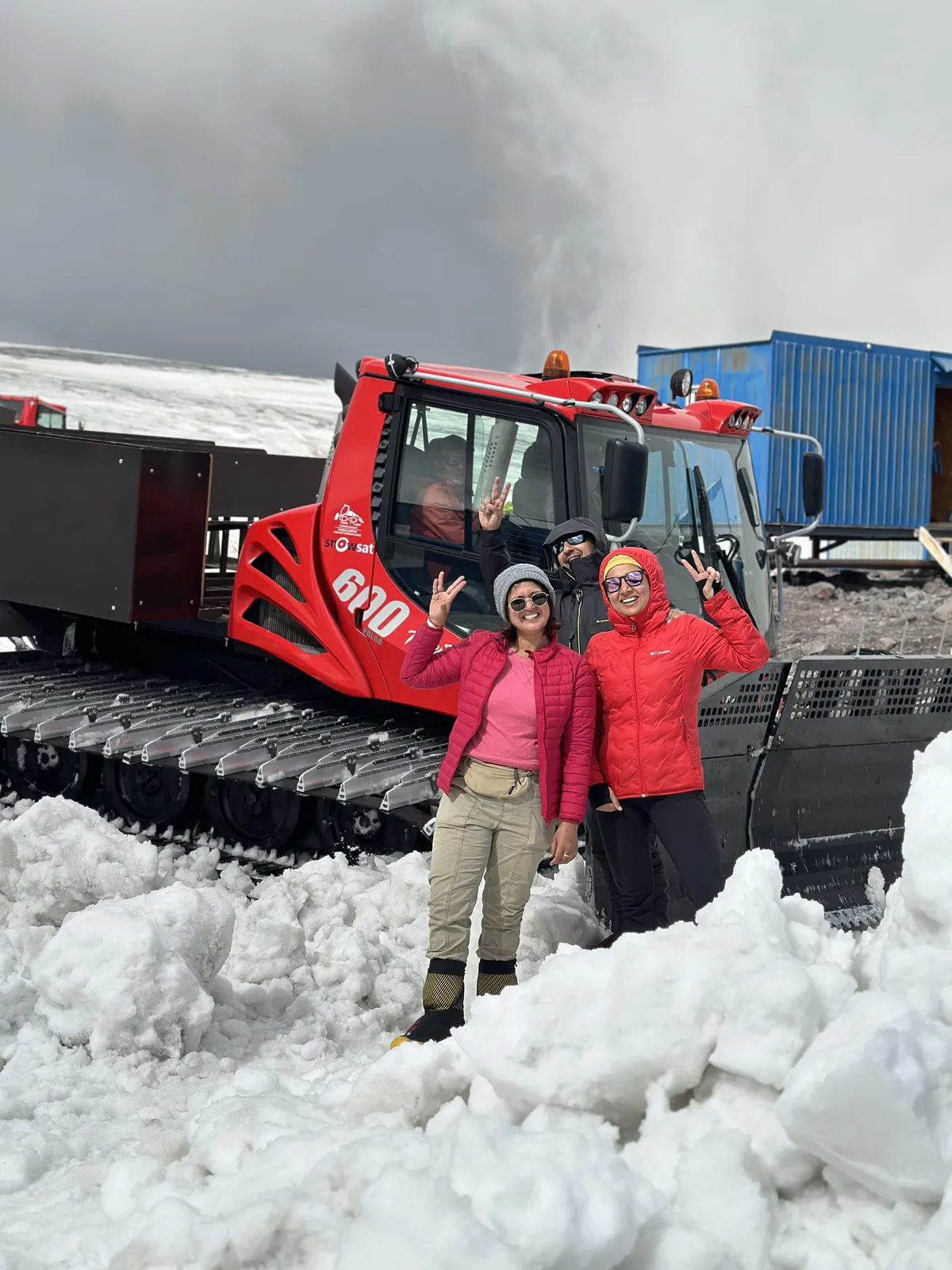Mountain winter friends snow on the Mount Elbrus group trip with One in the Orange Jacket.