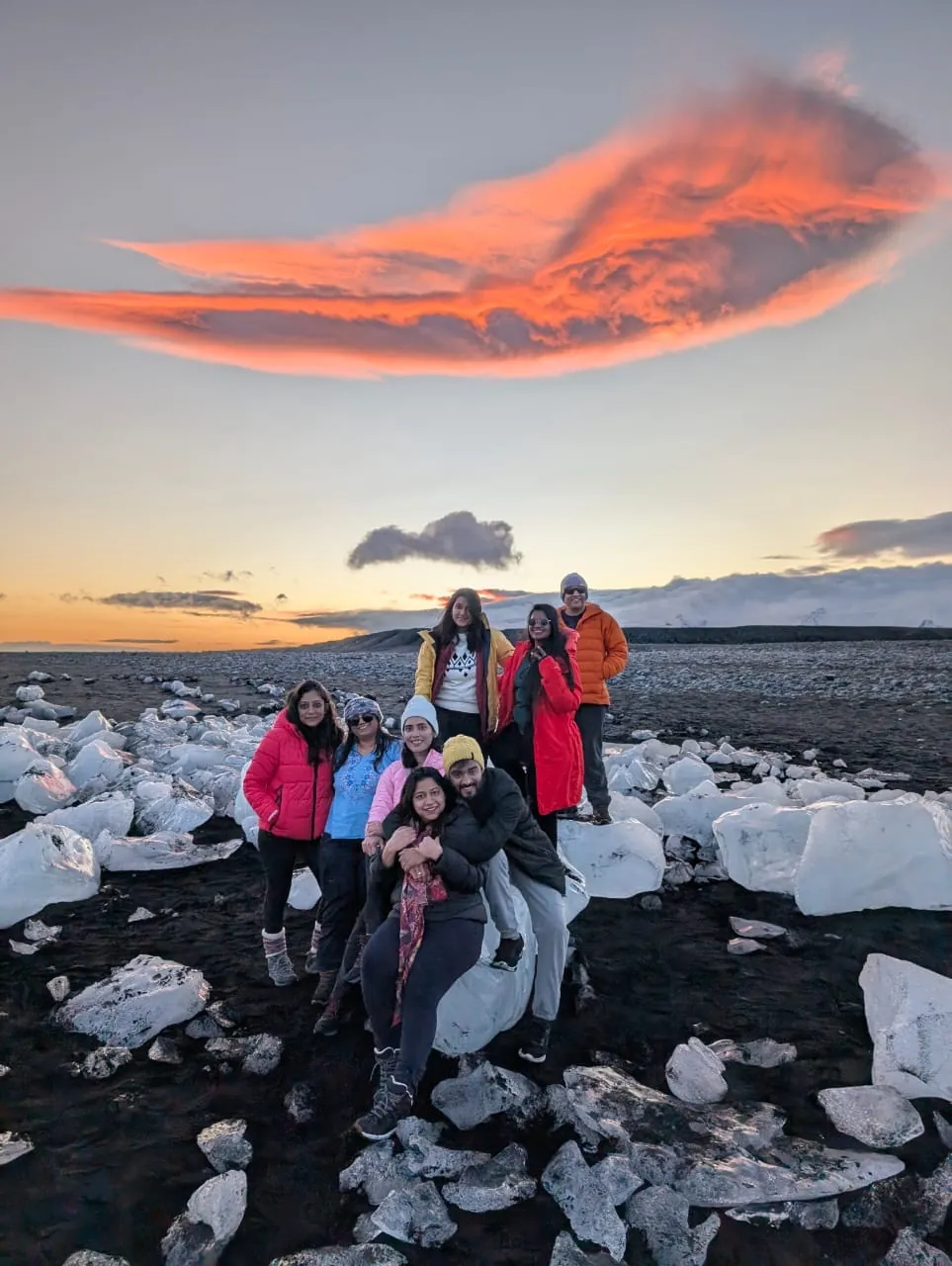 Sunset cloud happy ice on the Iceland group trip with One in the Orange Jacket.