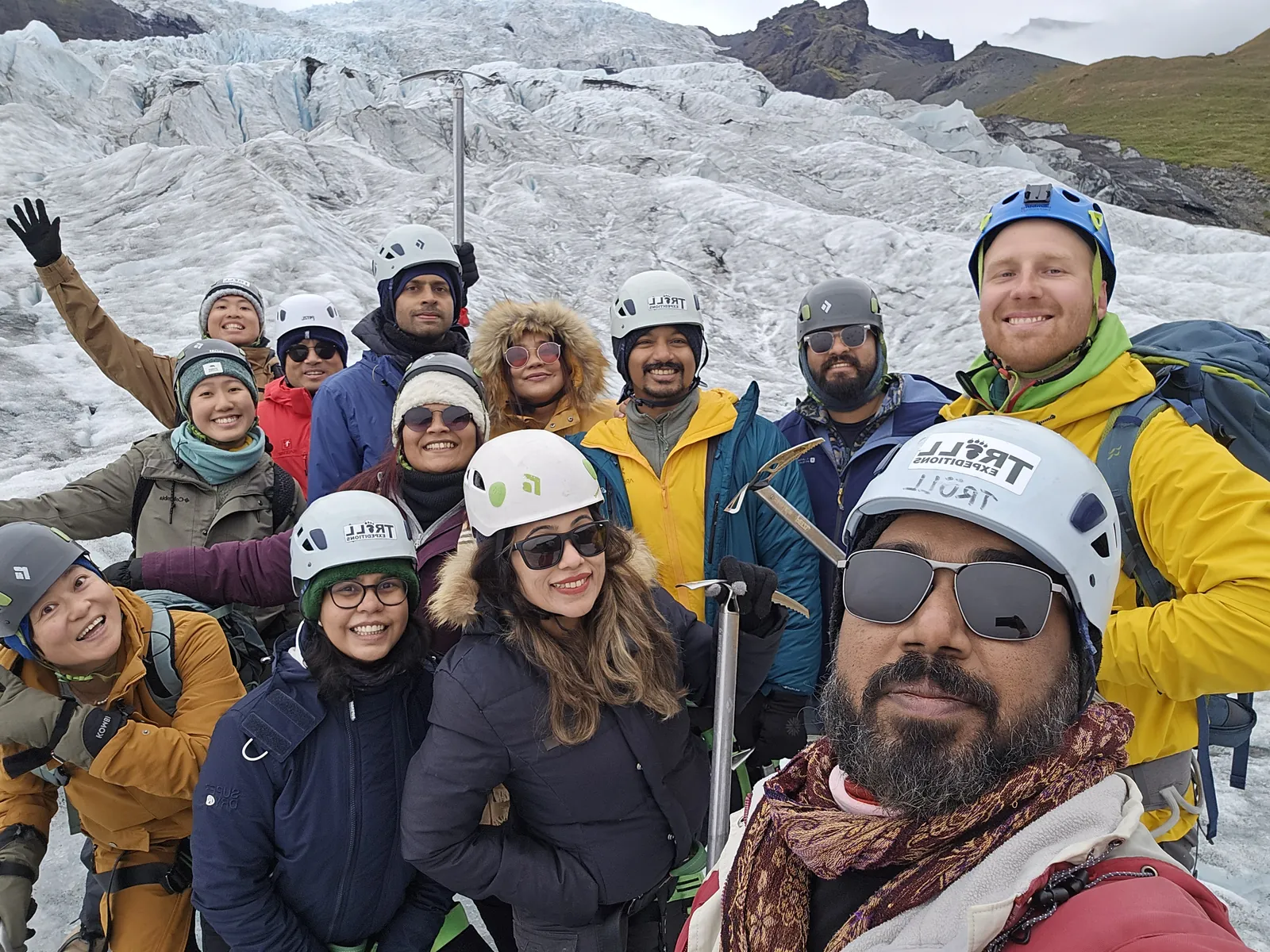 Glacier showcasing fun on the Iceland group trip with One in the Orange Jacket.