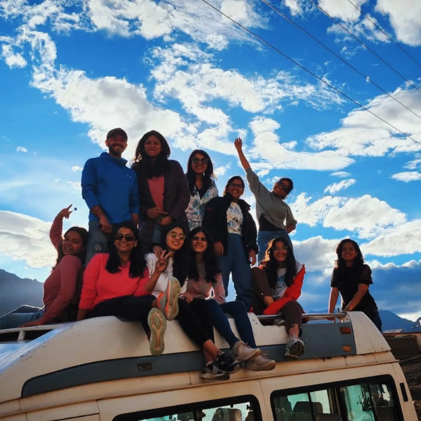 Mountain sky showcasing fun on the Meghalaya group trip with One in the Orange Jacket.