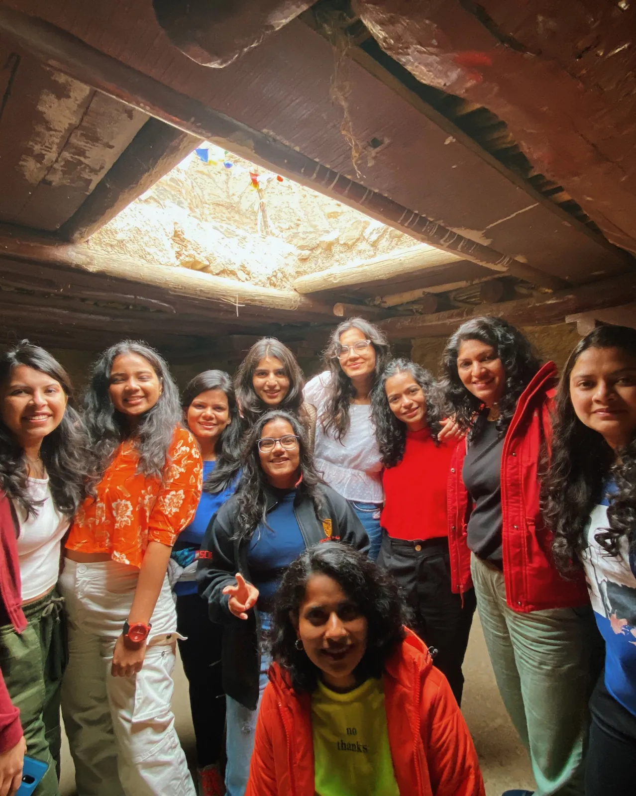 Smiles lighting on the Meghalaya group trip with One in the Orange Jacket.
