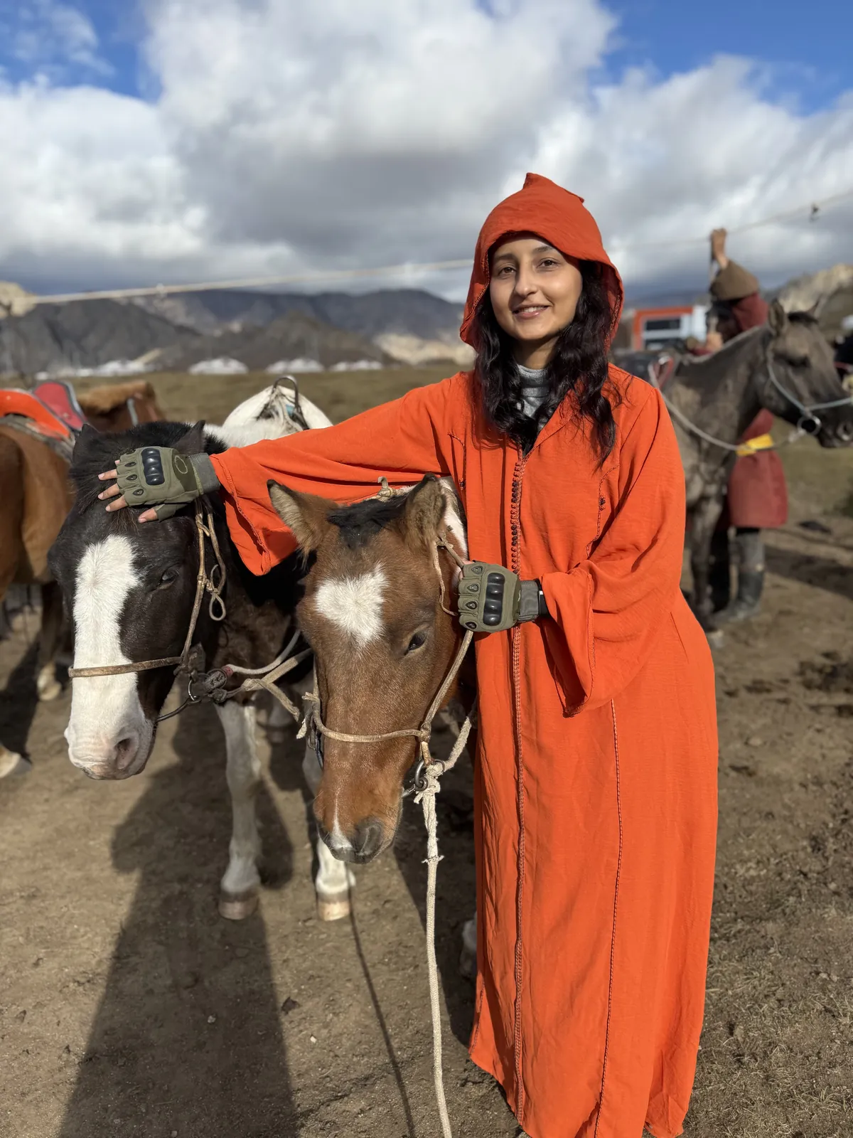 Posing horses on the Mongolia group trip with One in the Orange Jacket.