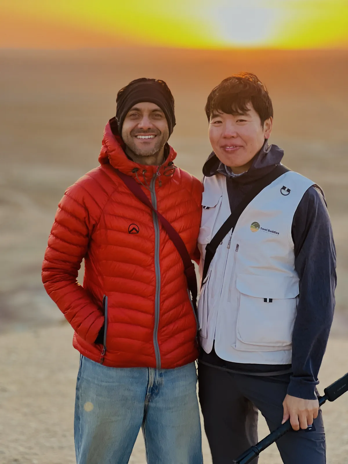 Sunset smiling on the Mongolia group trip with One in the Orange Jacket.