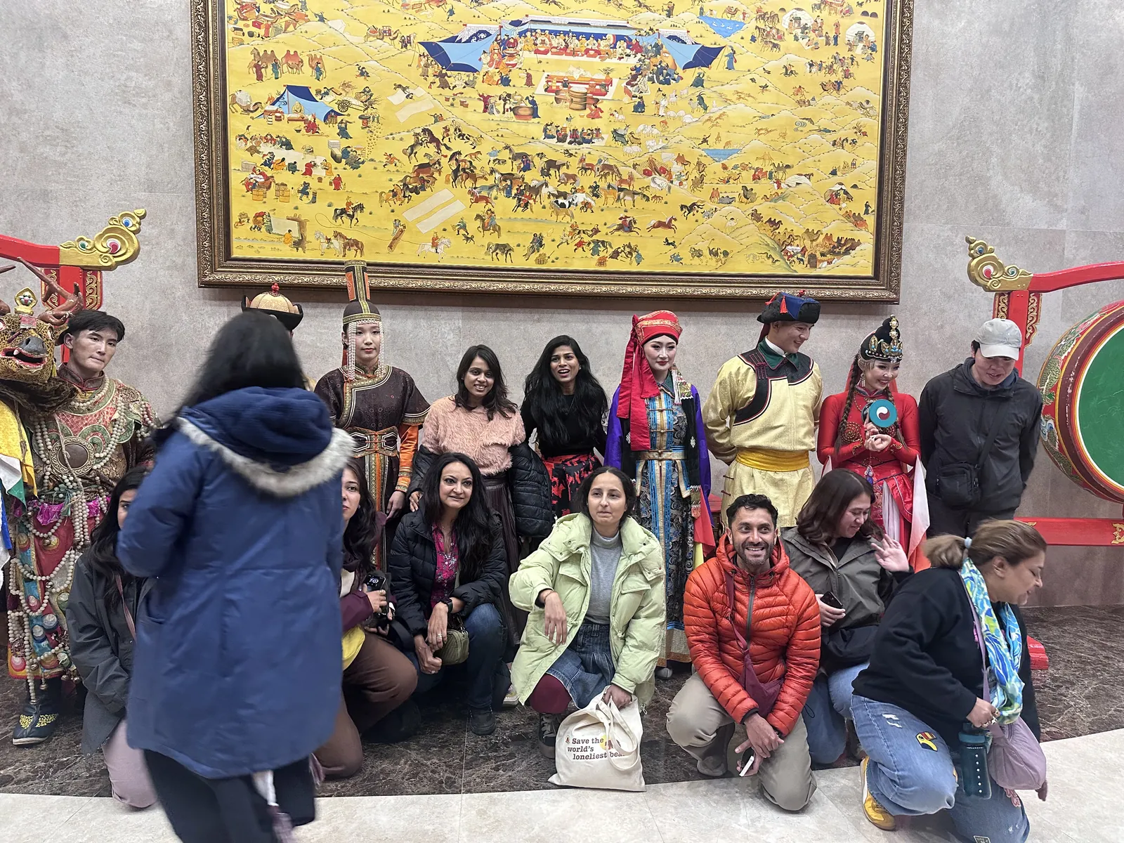 Traditional attire on the Mongolia group trip with One in the Orange Jacket.