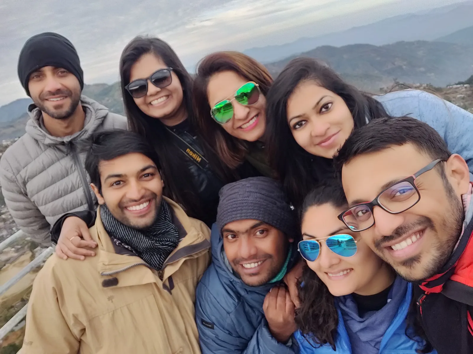 Mountain selfie happy faces on the Nagaland group trip with One in the Orange Jacket.