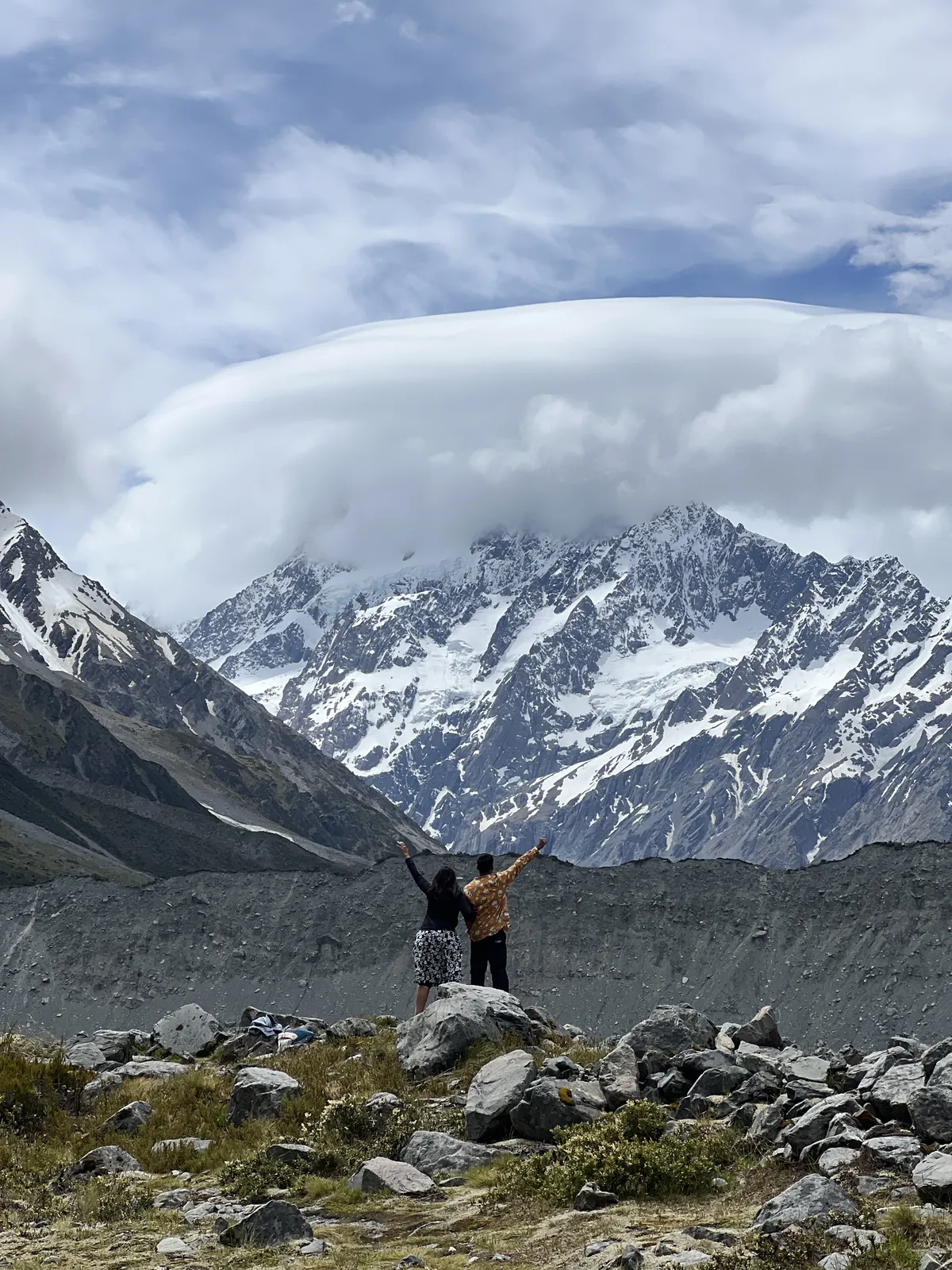 Mountain celebrating rocky on the New Zealand group trip with One in the Orange Jacket.