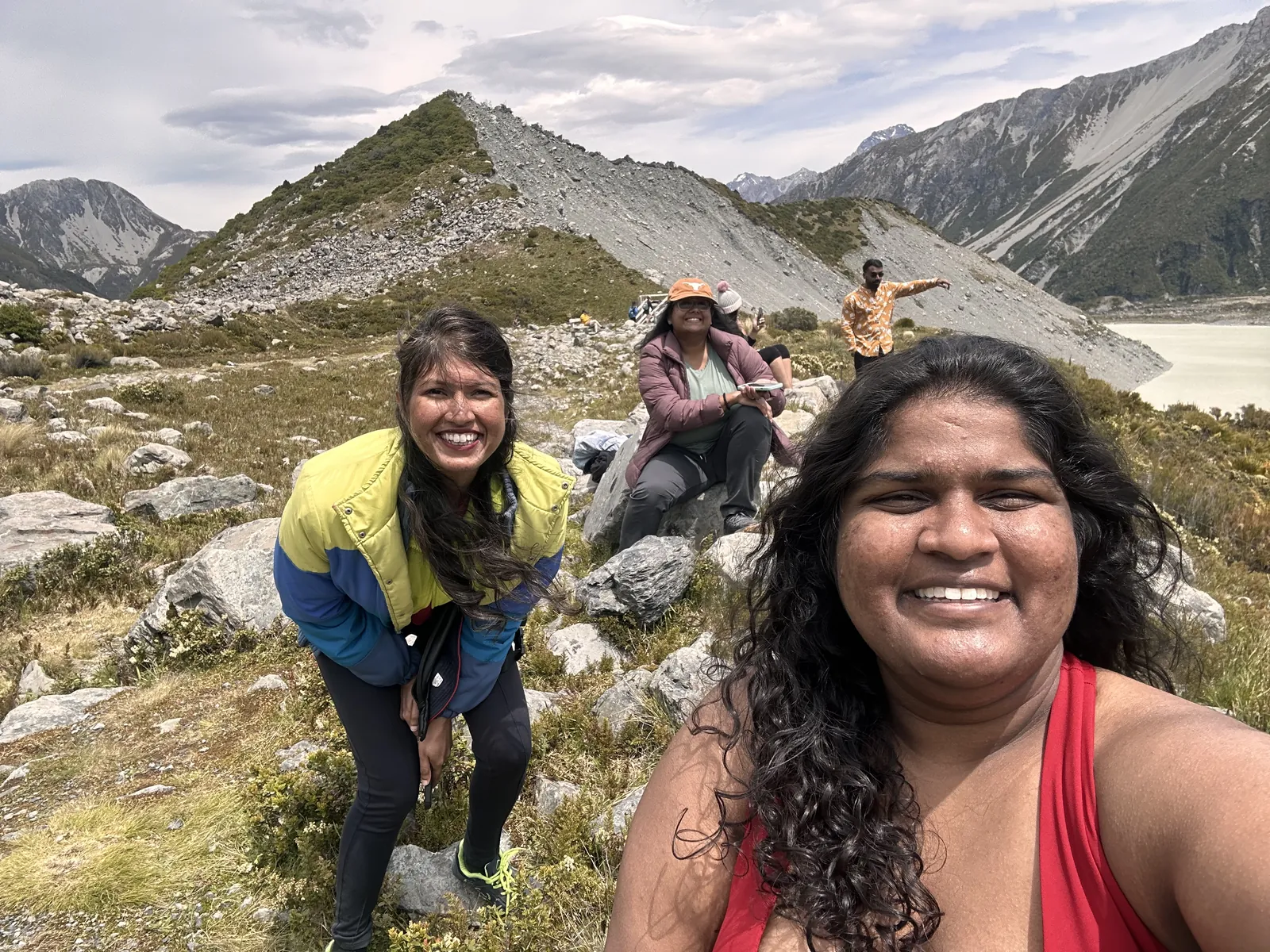 Mountain friends enjoying scenic on the New Zealand group trip with One in the Orange Jacket.