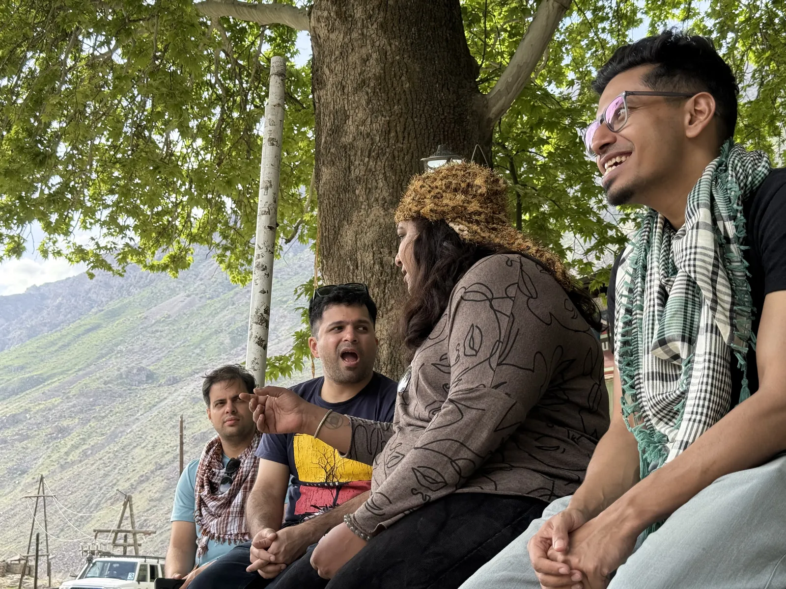 Mountain point on the Pamir Highway group trip with One in the Orange Jacket.