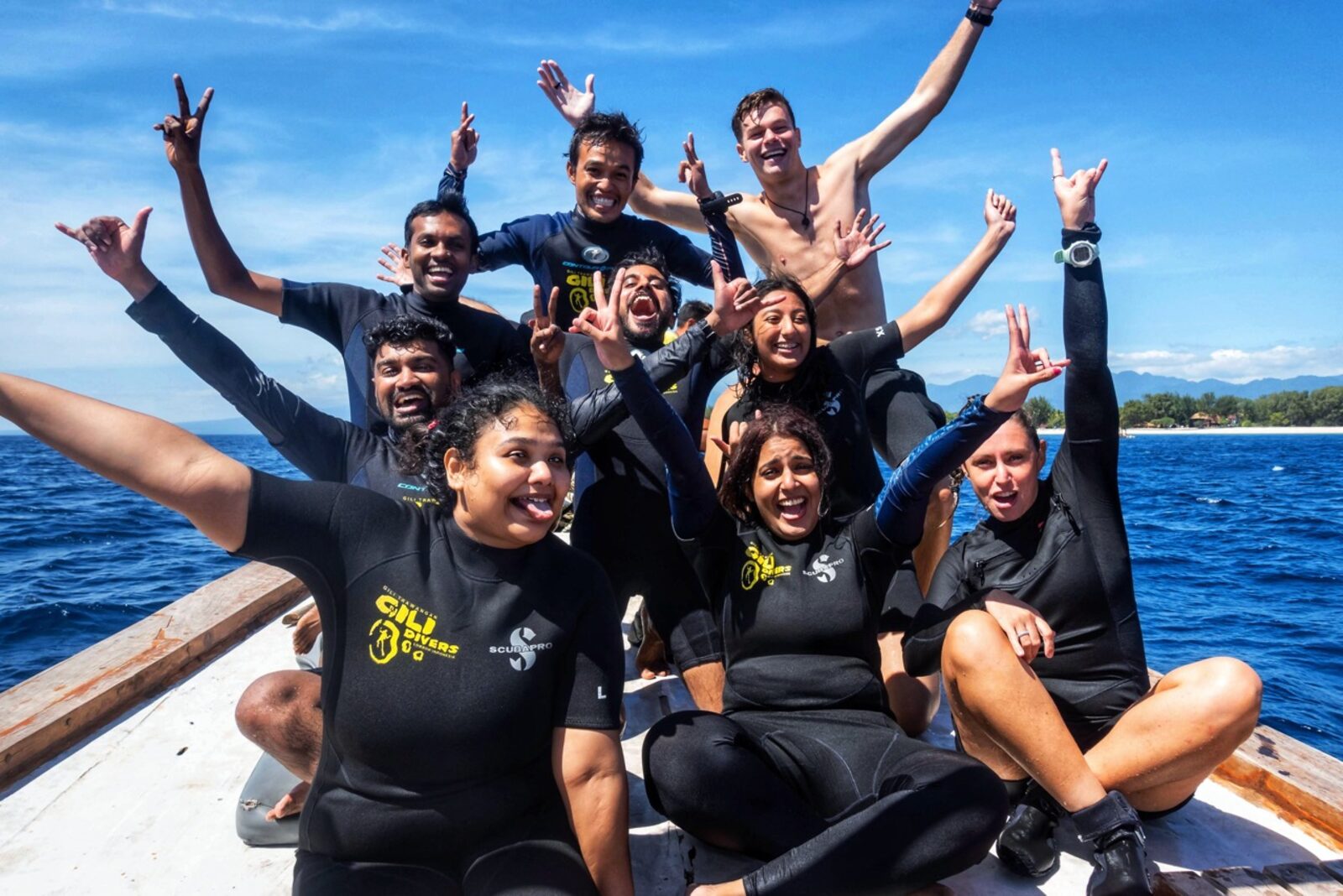 OJ trippers post-dive on the boat at Gili T