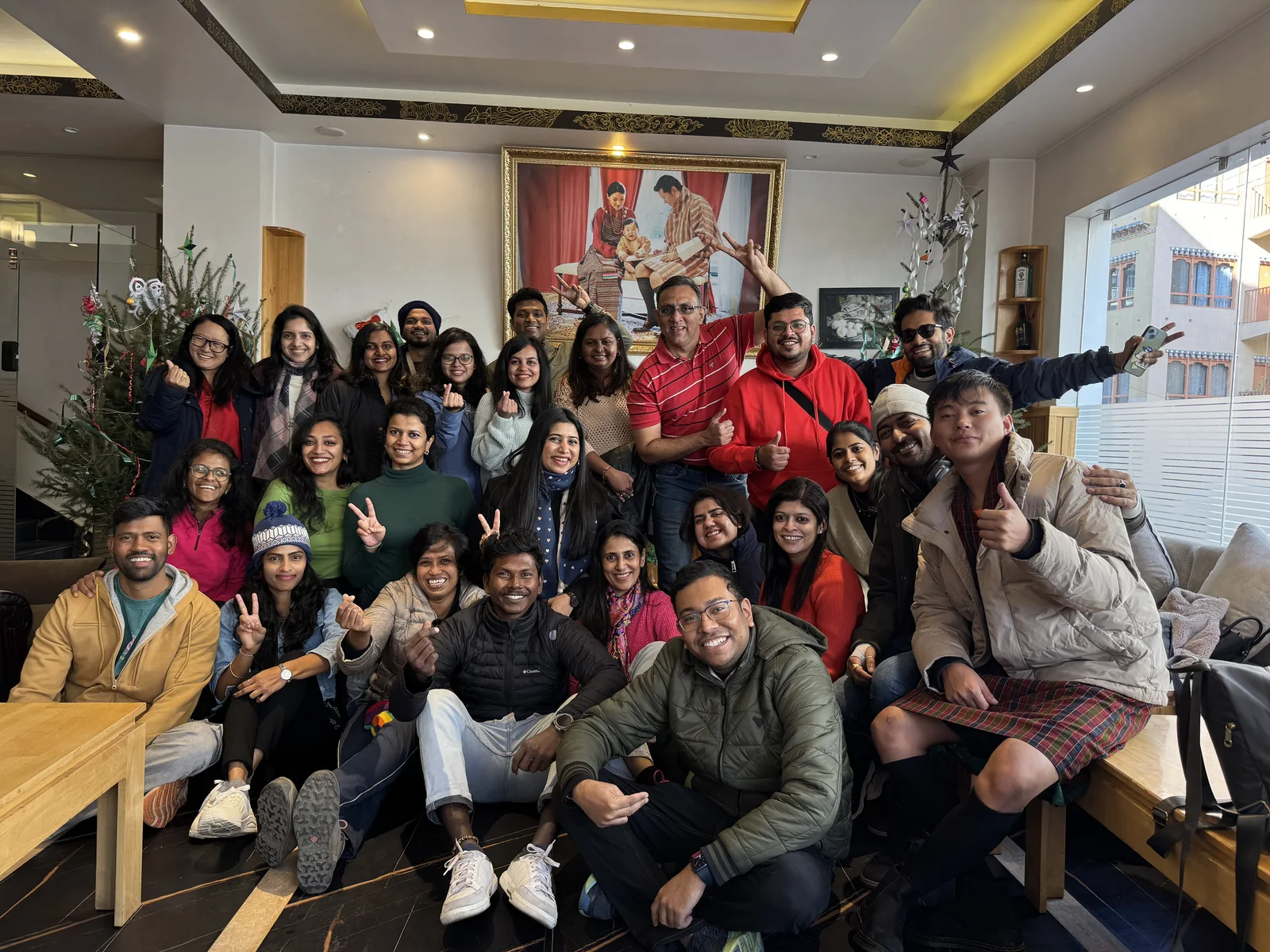 Big OJ group posing together in a Bhutan hotel lobby