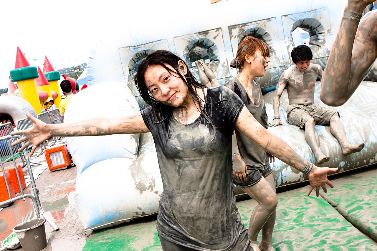 Crowds covered in mud at the Boryeong Mud Festival in South Korea