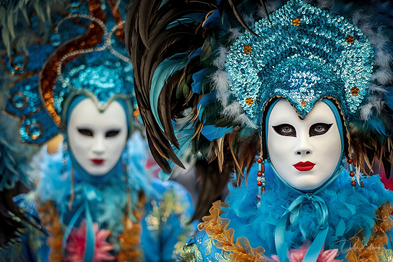 An elaborately masked and costumed figure at the Carnival of Venice