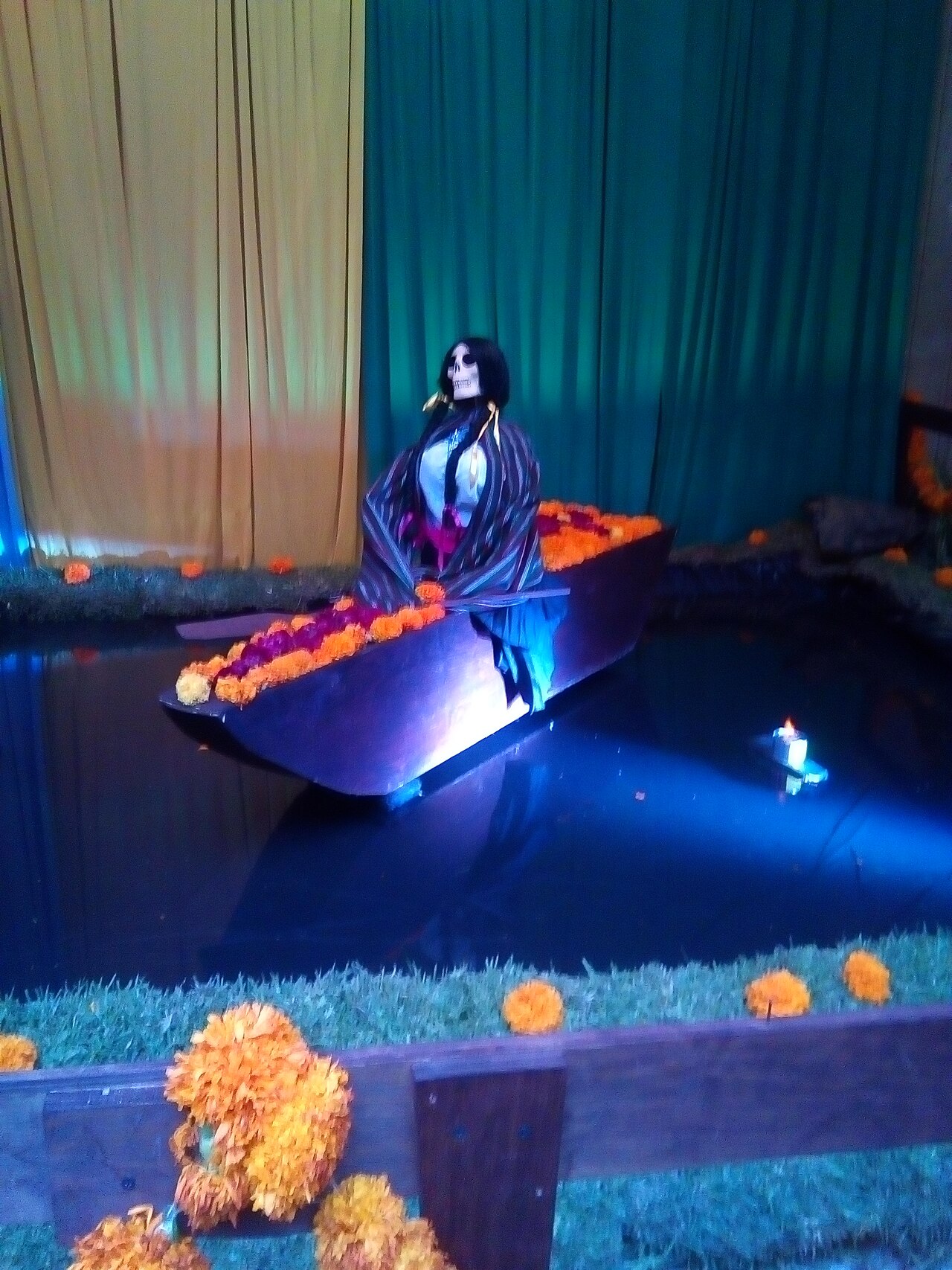 A Day of the Dead altar with marigolds, candles, and sugar skulls in Mexico