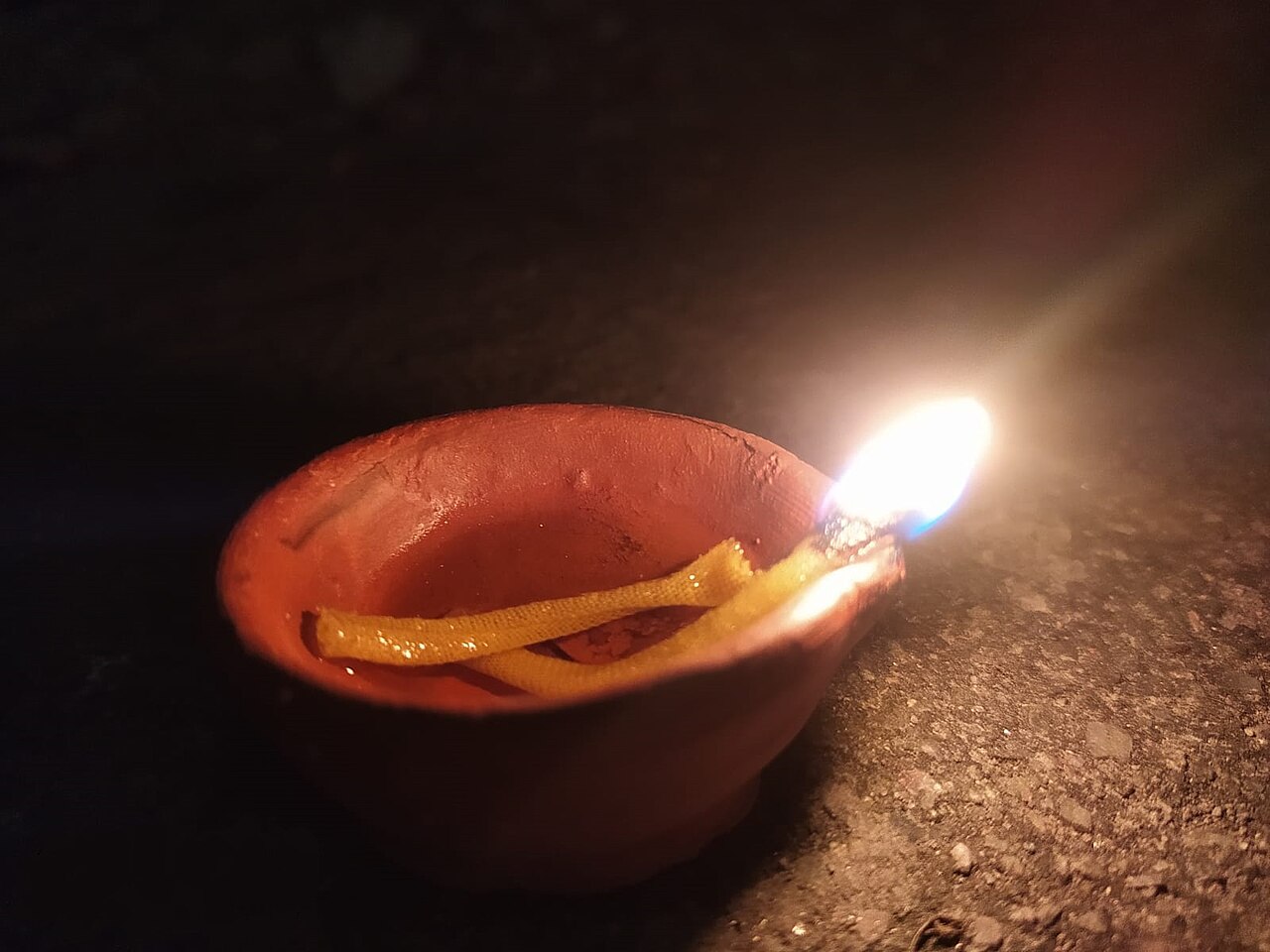 Oil lamps and rangoli glowing during Diwali in India