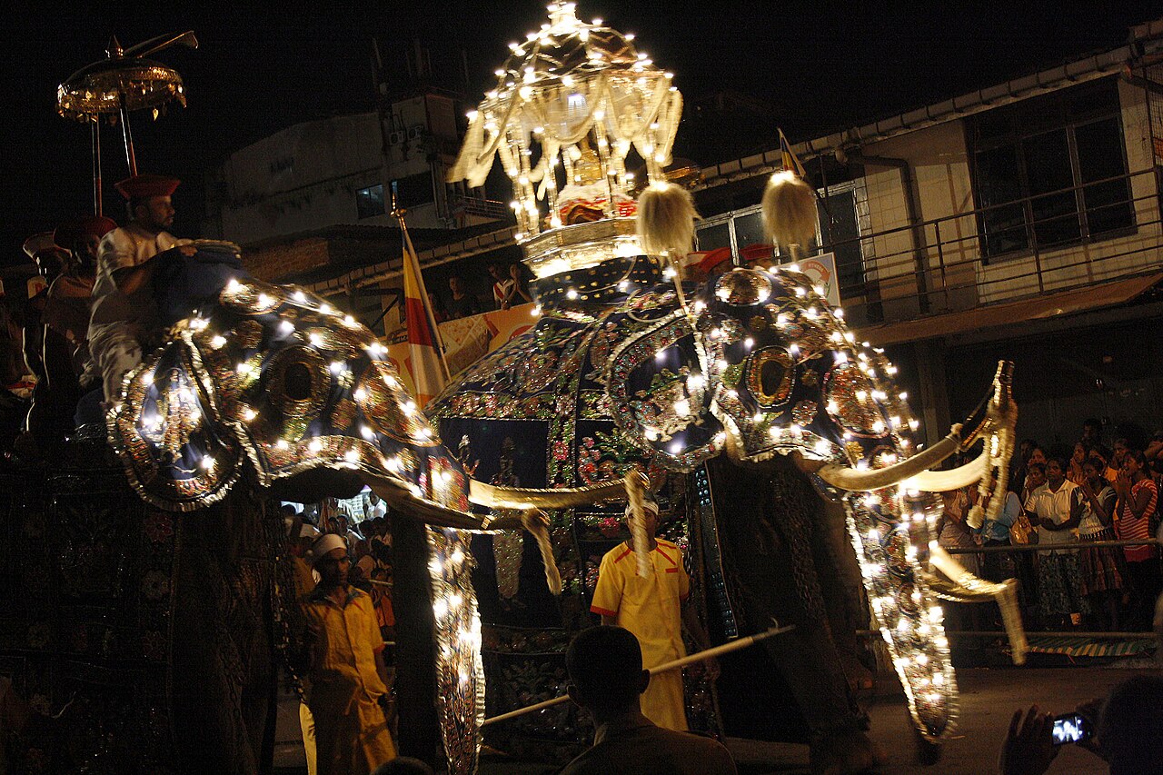 Caparisoned elephants and dancers at the Kandy Esala Perahera in Sri Lanka