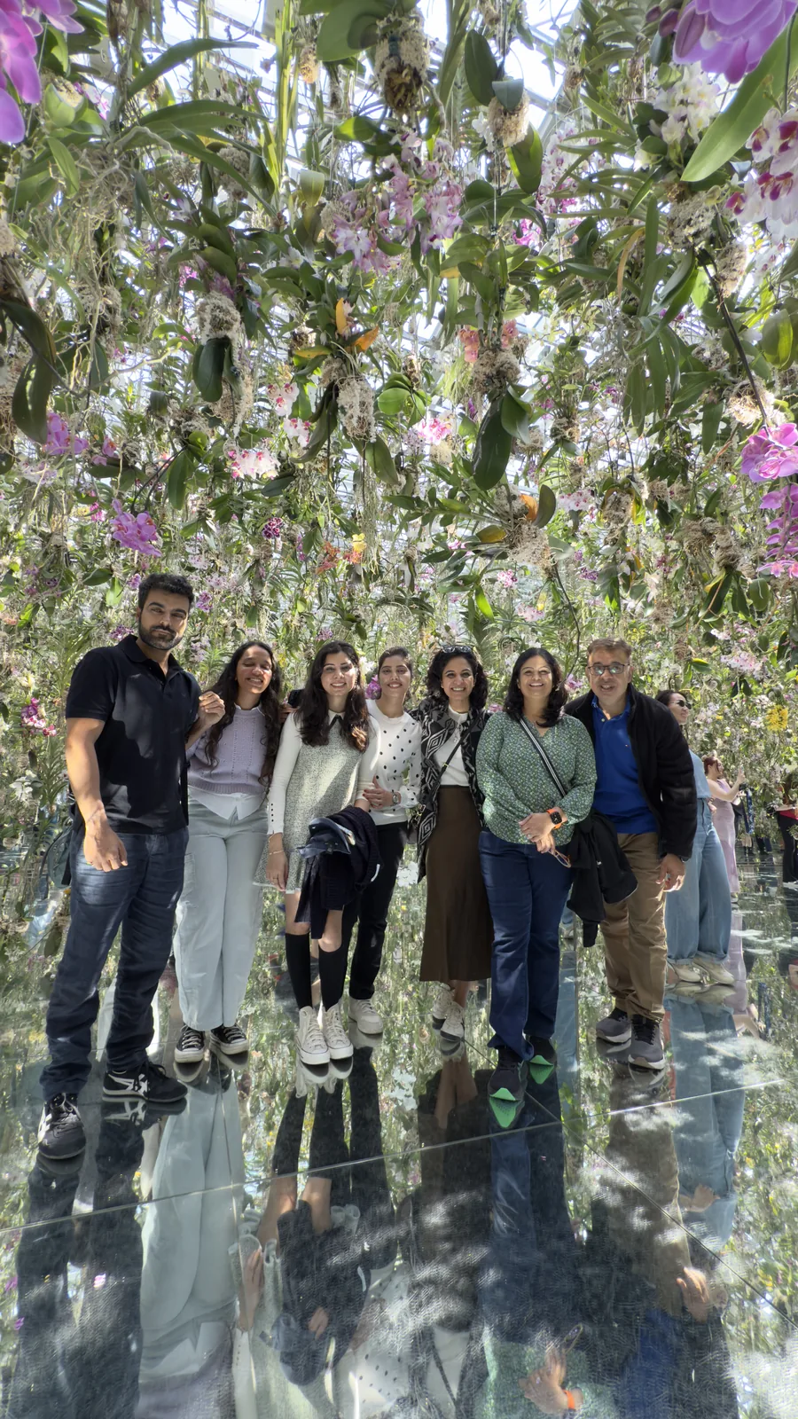 Japan, Day 2: OJ group standing under the hanging orchid ceiling at teamLab Planets