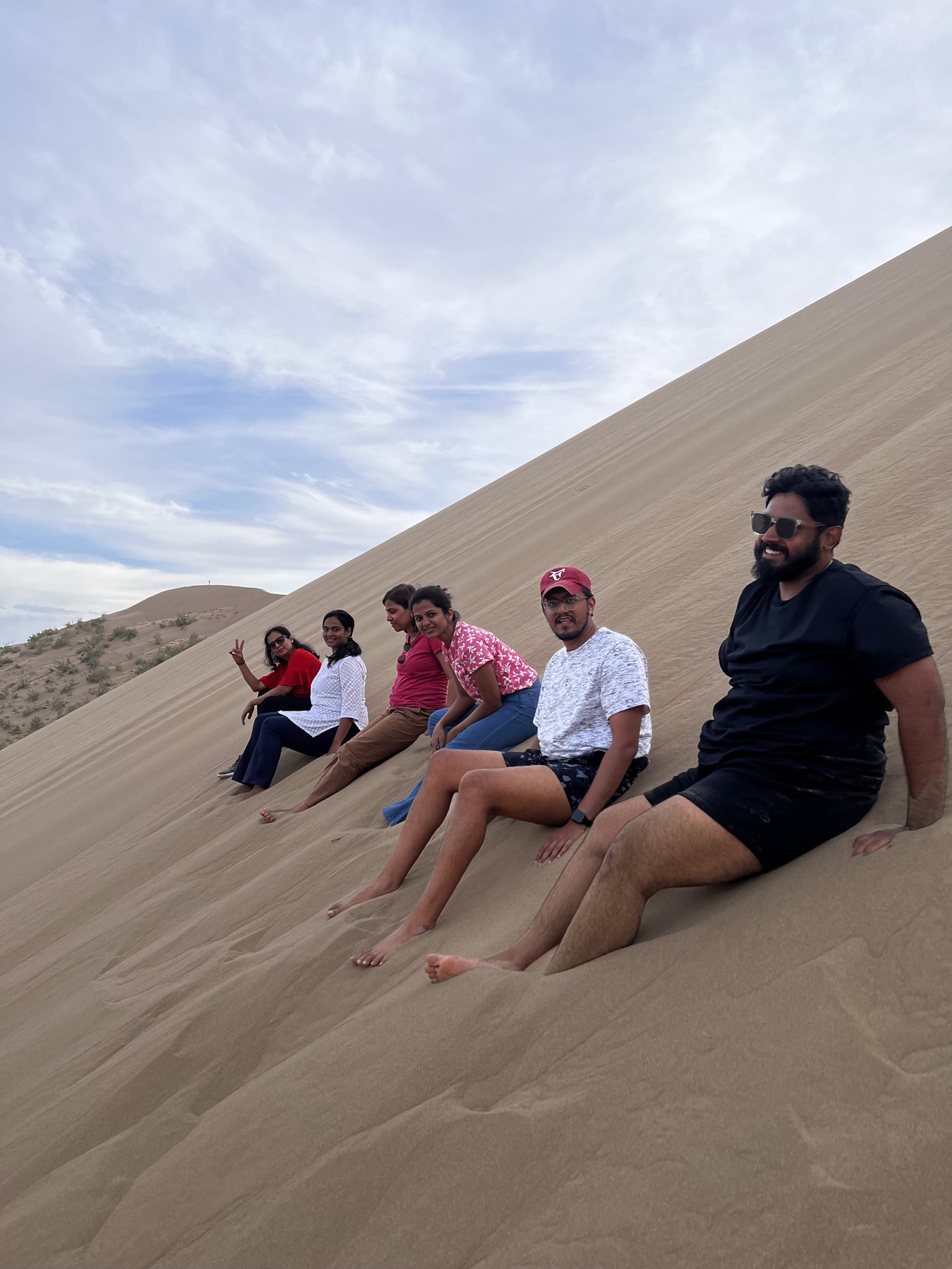 The crew on the slope of the Singing Dune
