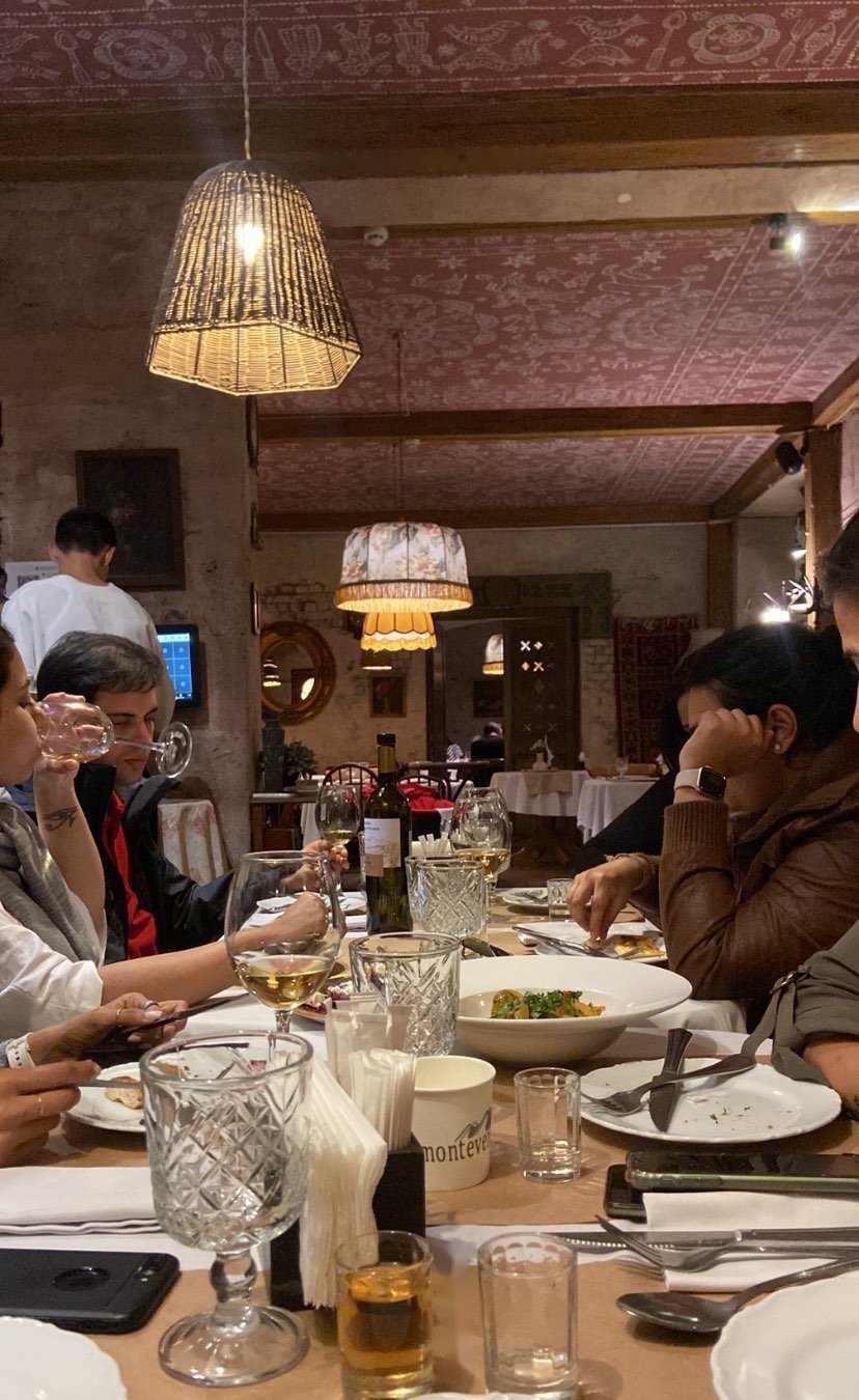 The crew around a long table at the Georgian dinner