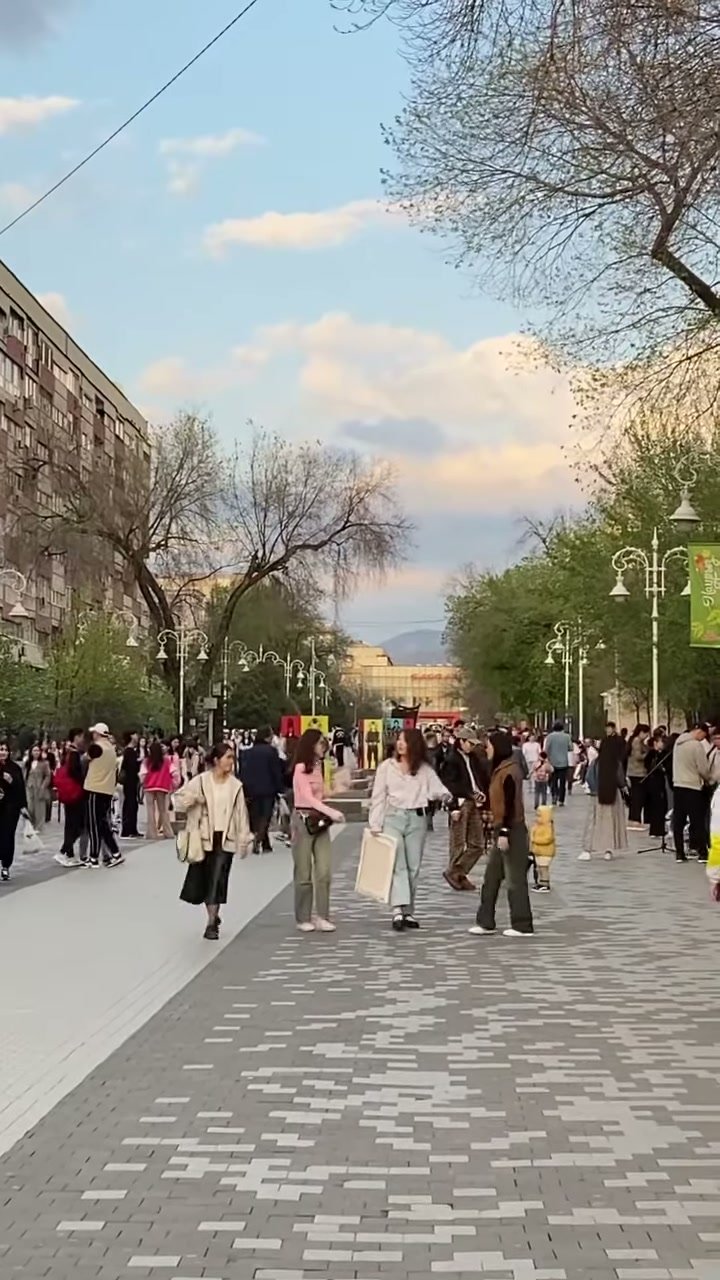 Almaty pedestrian street at golden hour on the last walk