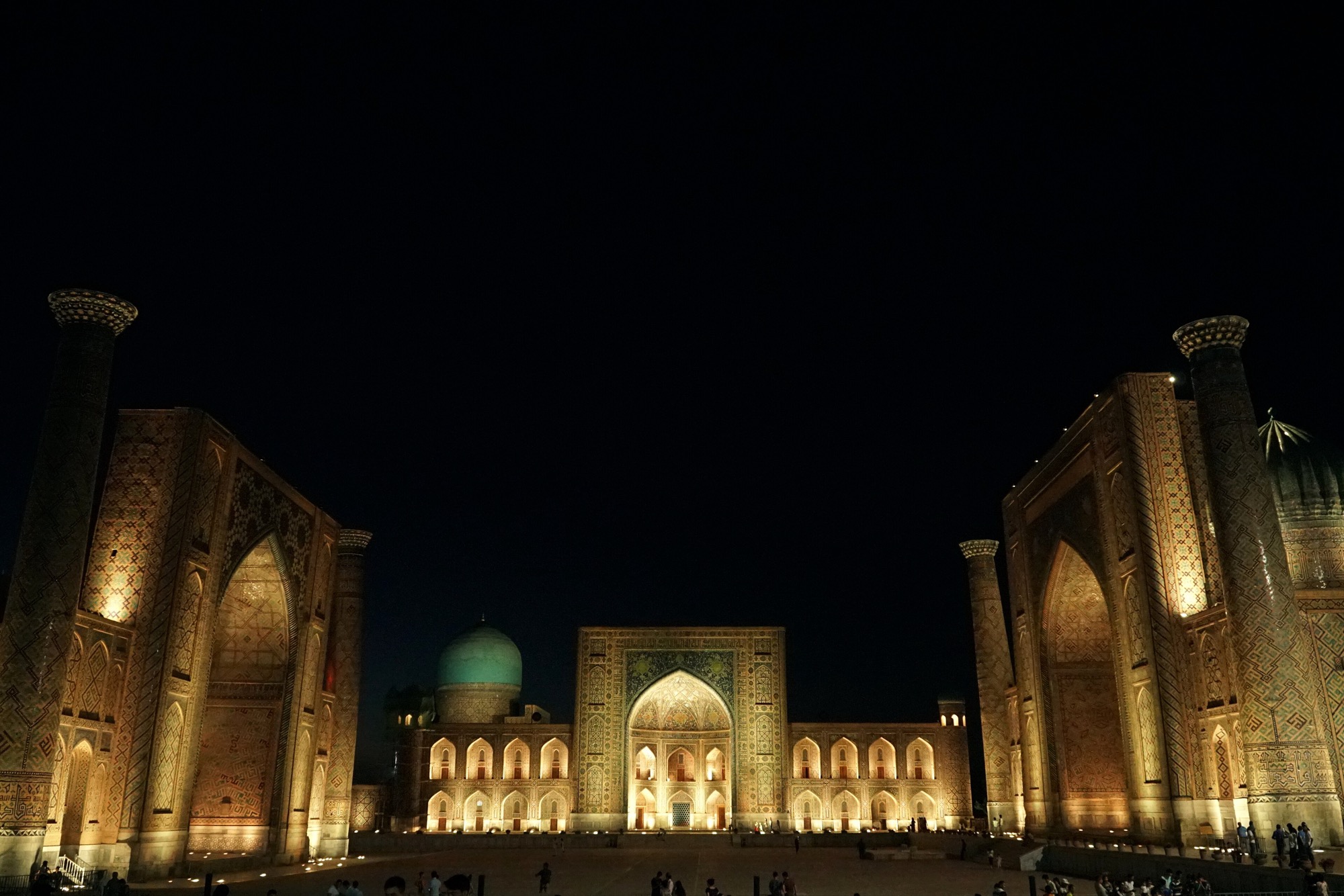 The Registan in Samarkand lit up after dark