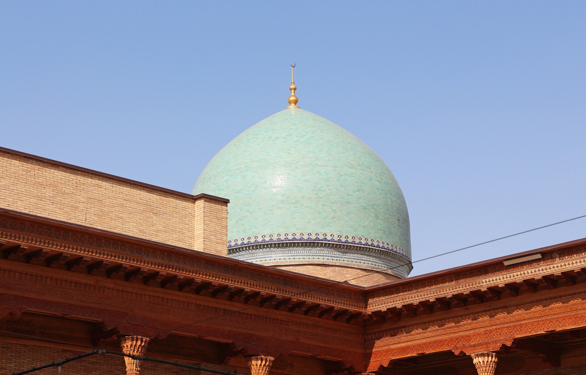 The wooden portico and green dome at the Hast Imam complex, Tashkent