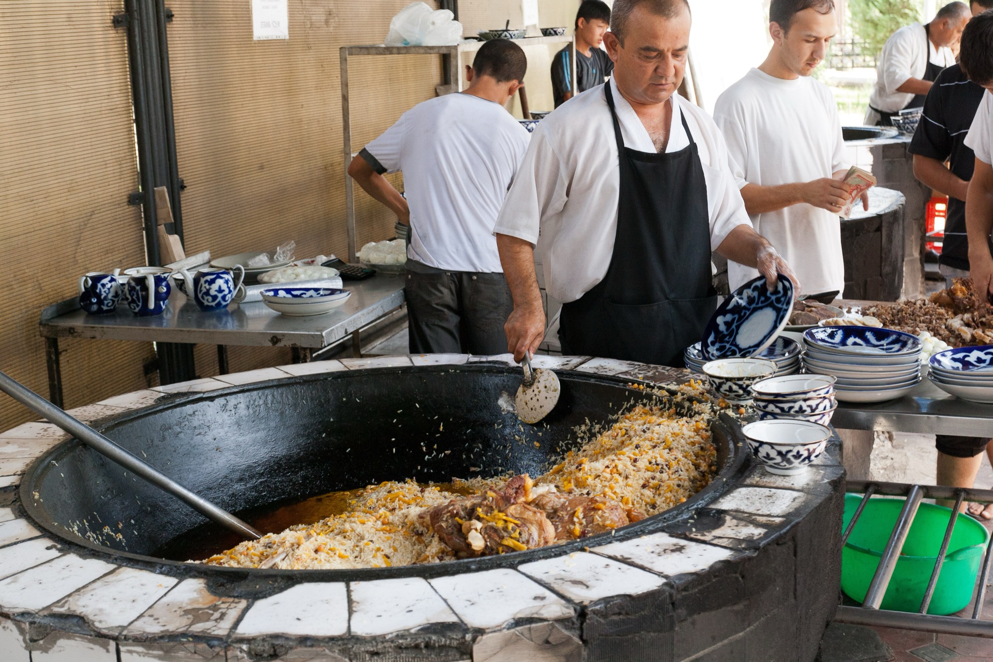 Plov cooking in a giant kazan at the Central Asian Plov Centre, Tashkent