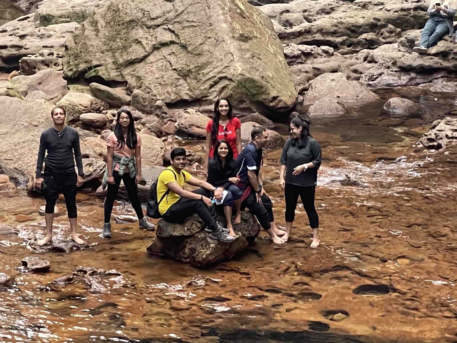 Meghalaya, Day 3, sacred forest and David Scott Trail: group standing in a shallow rocky river on the trail