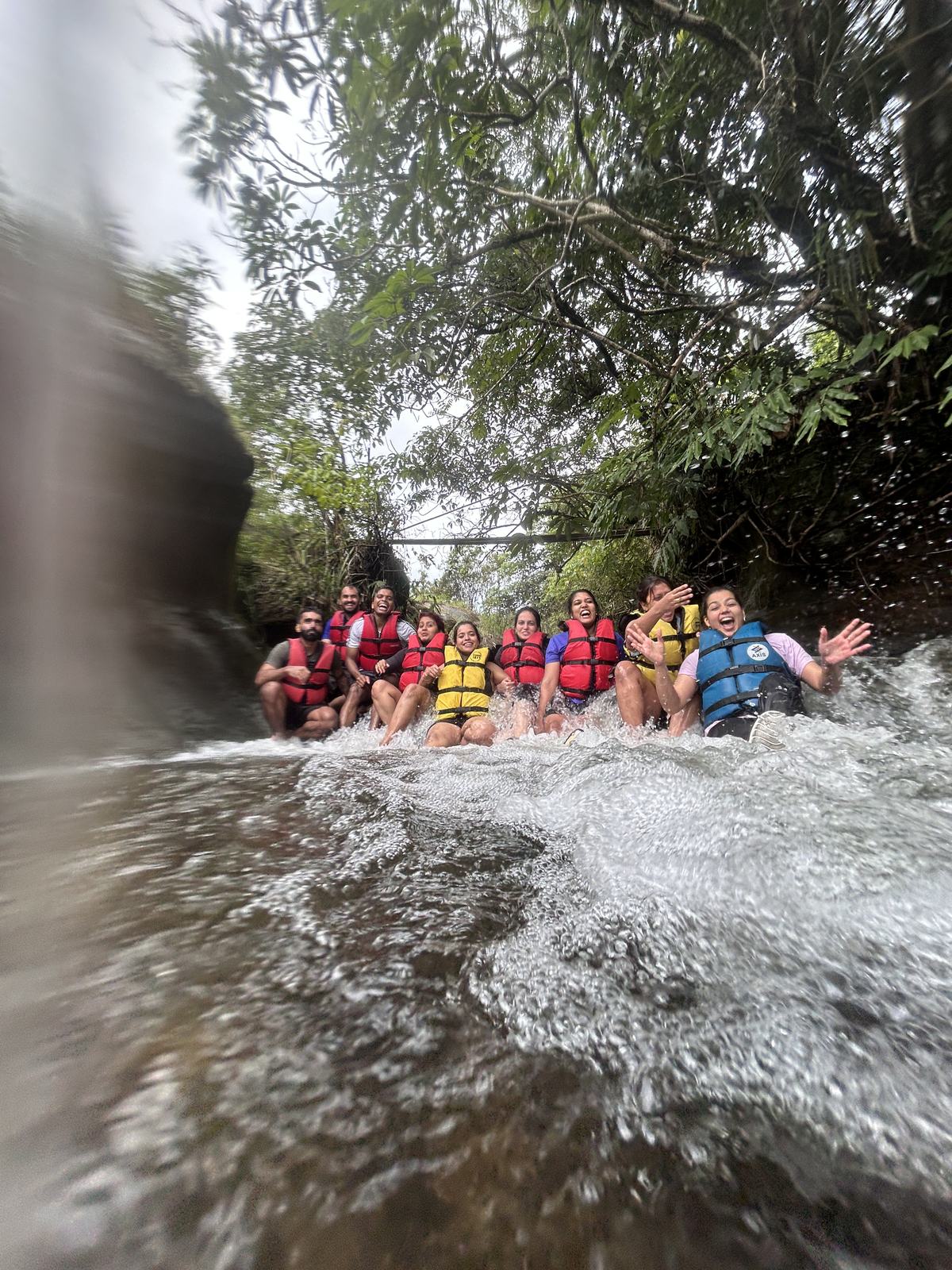 Meghalaya, Day 2, river canyoning: group in life vests laughing through rapids