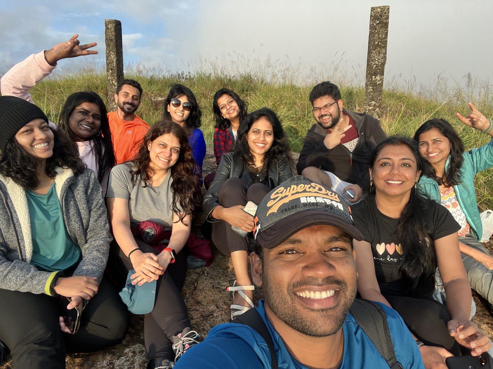 Meghalaya, Day 9, depart from Meghalaya: group selfie on a grassy hilltop