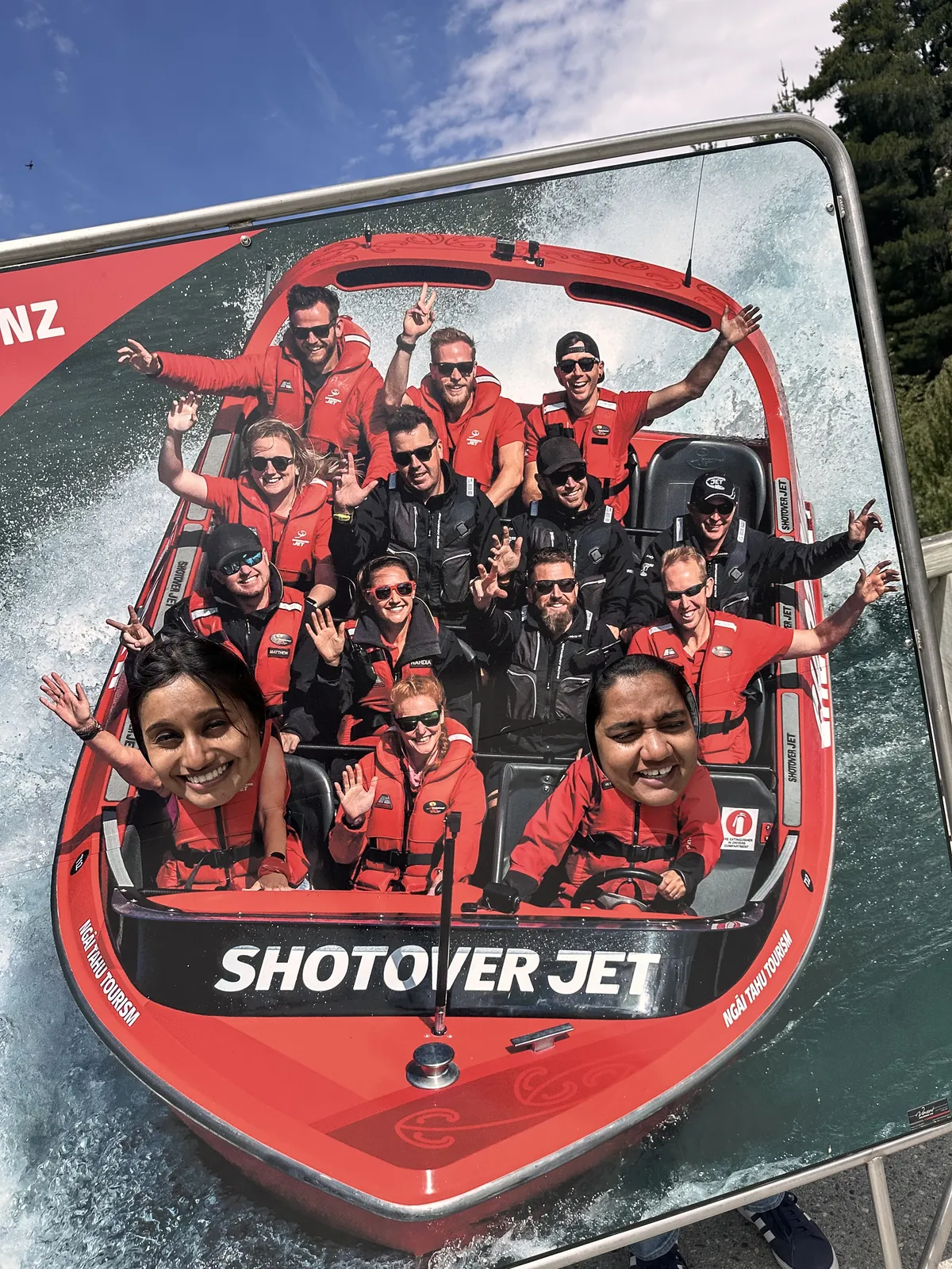 OJ group on a red Shotover Jet boat banking through the river in Queenstown