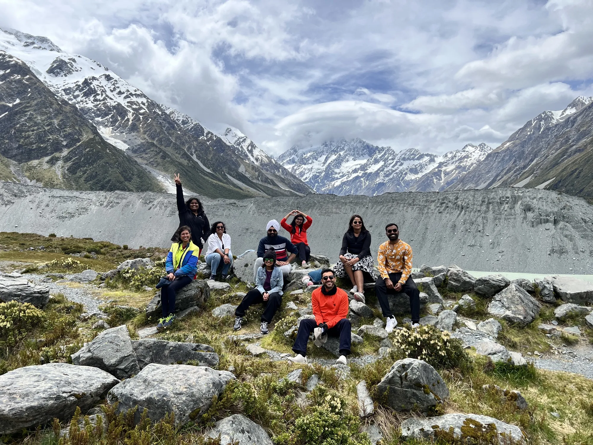 New zealand day 9 group mountain poses against glacier