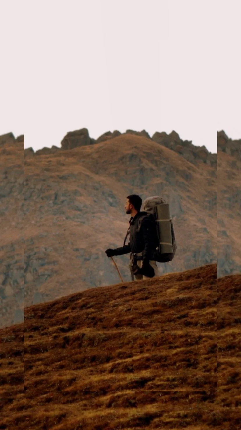 Trekker on the brown ridge near Kalu Vinayak