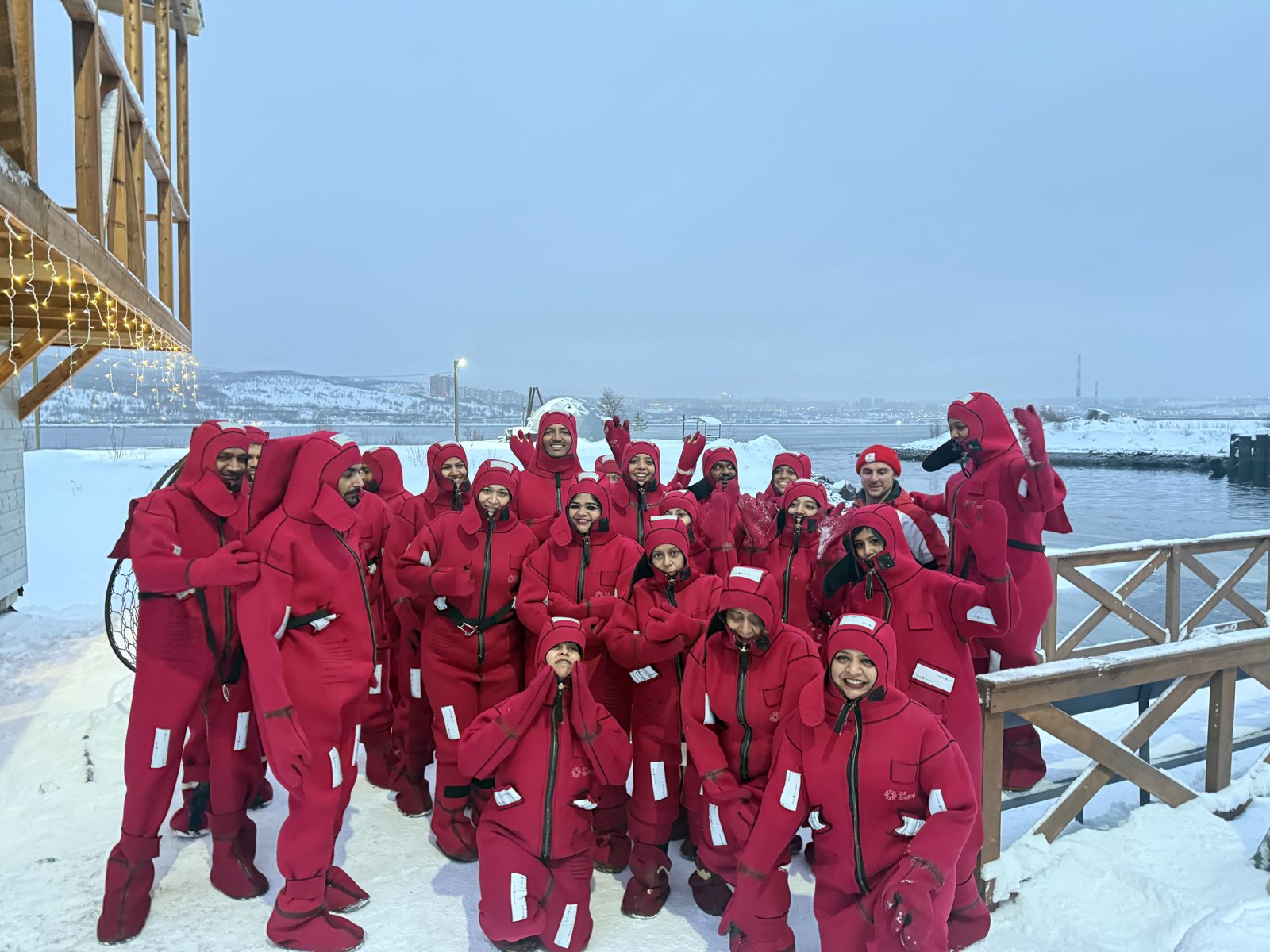 OJ trippers in red survival suits before Arctic floating