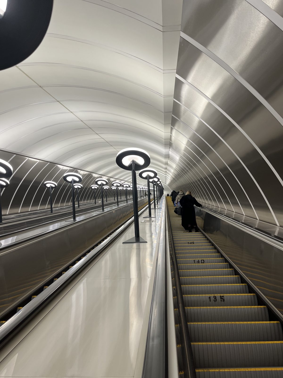 A long escalator down into the Moscow metro