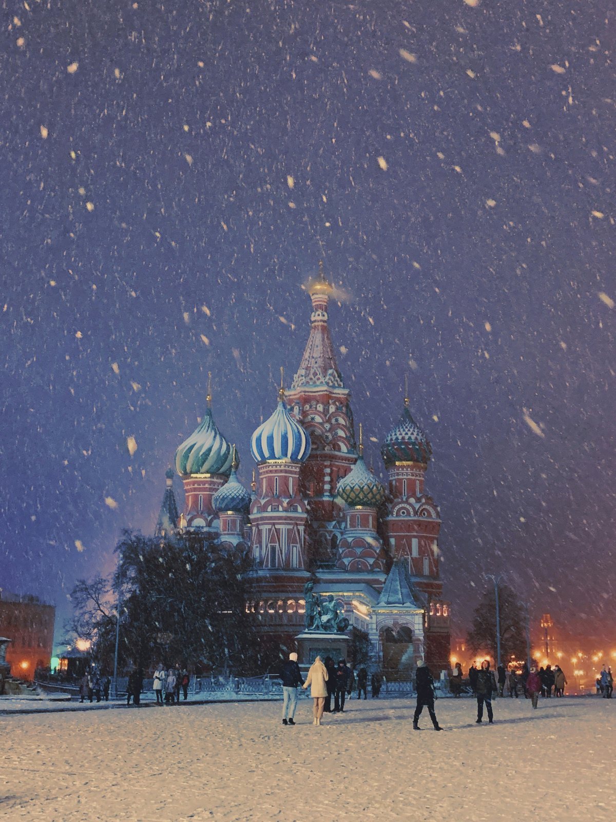 Snow falling on St Basil's at night
