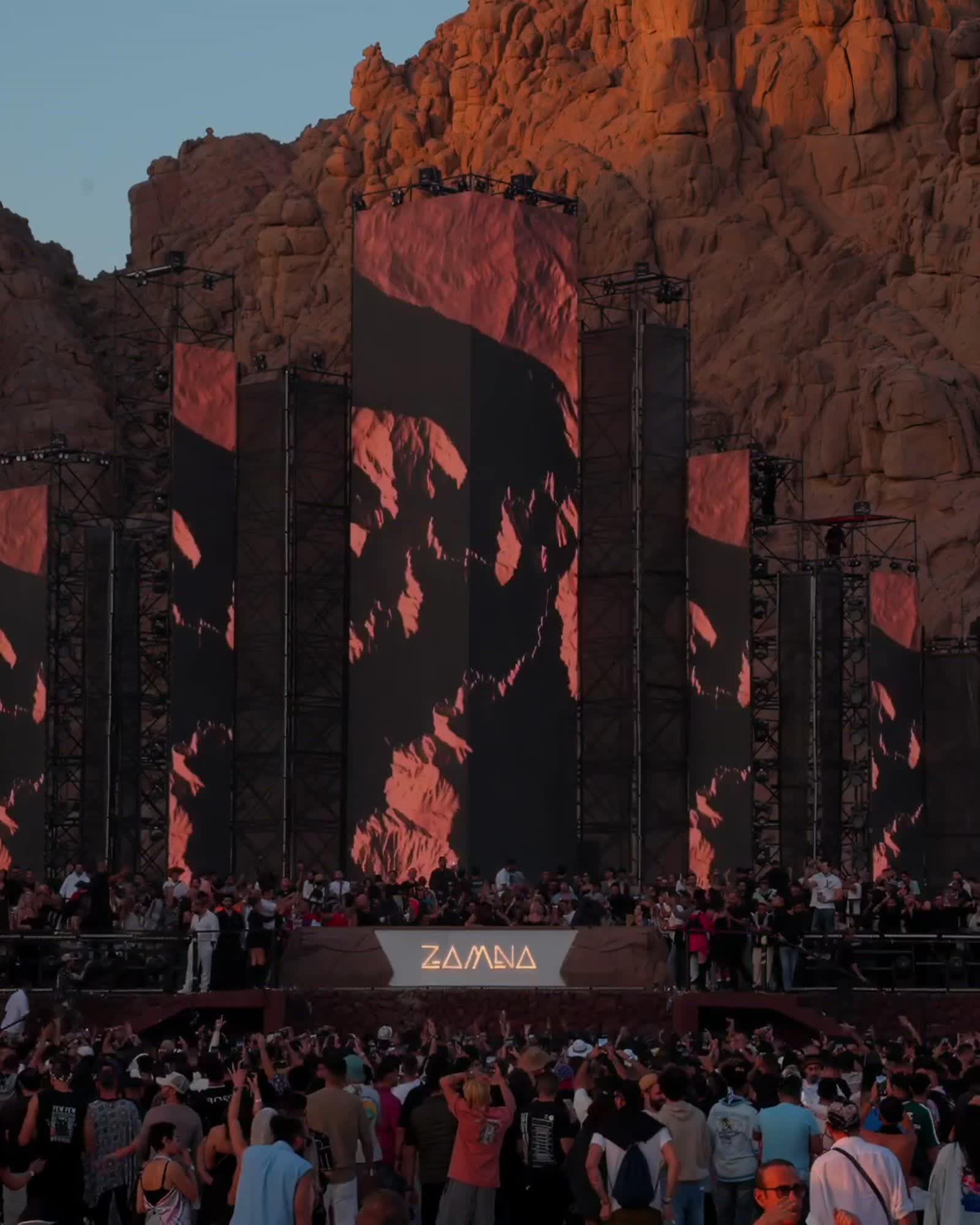 Zamna main stage set against the Khoroum Valley cliffs