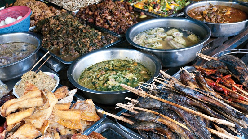 Sample Khmer cuisine at local restaurants and street food stalls